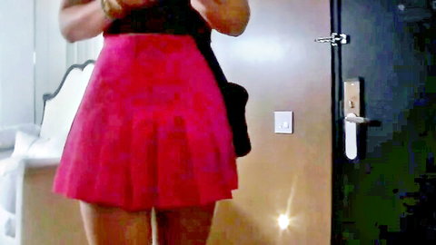 Niki Snow in short pink pleated skirt, casting couch tease