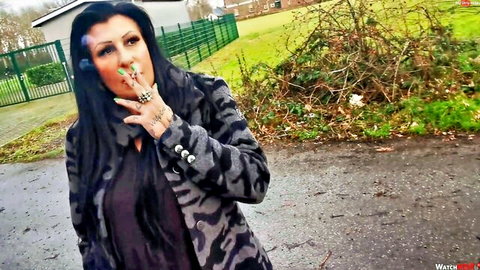 Lady Jamie smoking seductively outdoors in dirty talk fetish video