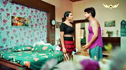 Horny Indian couple in bedroom, woman in black top red skirt teases man