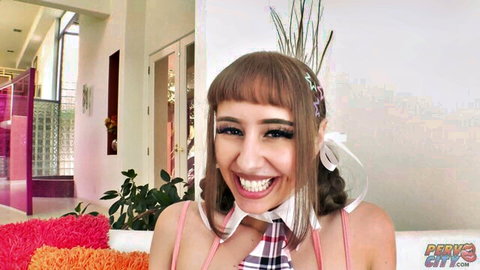 Cute smiling schoolgirl in plaid uniform and pink straps