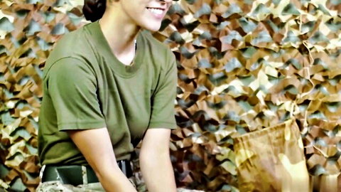 Madison Wilde in sexy army uniform, smiling in camouflage