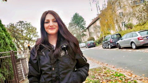 Katy Rose young brunette smiling outdoors in black jacket