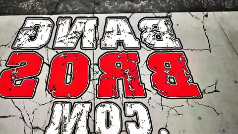 Dangerous graffiti sprayed on cracked gray concrete wall in bold red and white letters