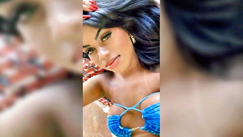 Stunning tgirl selfie in revealing blue bikini, showing cleavage