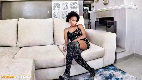 Busty Kenyan model in sparkling top and stockings on casting couch