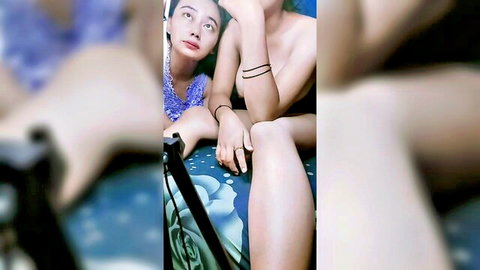 Big titted Asian amateur topless exposing huge boobs on bed