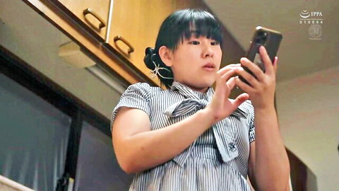 Shoko Matsumoto in striped dress, surprised expression on phone