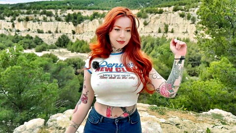 Chloé, 28yo redhead from Versailles, tattooed in crop top and jeans outdoors