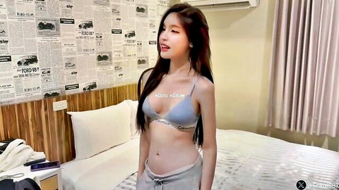 Thai model Nong Rin in gray Calvin Klein bra and sweatpants posing seductively