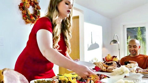 Curvy blonde with huge tits in tight red dress serves Thanksgiving turkey to smiling man