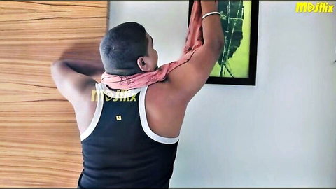 Indian man in black tank top hanging red scarf in bedroom adult scene