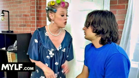 Nerdy guy chats with hot blonde MILF in curlers and floral dress
