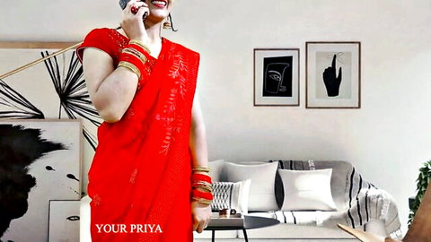 Your Priya in red saree on Karva Chauth, smiling teasingly