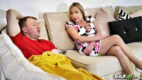 Holly catches young man masturbating, blonde MILF in floral dress