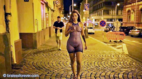 Agatha Vega in see-through mesh dress, teasing public nudity on night street