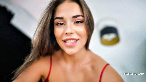 Smiling brunette teen in red bra teasing cleavage POV closeup
