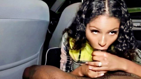 Curly-haired ebony baddie gripping and sucking big black cock in car POV