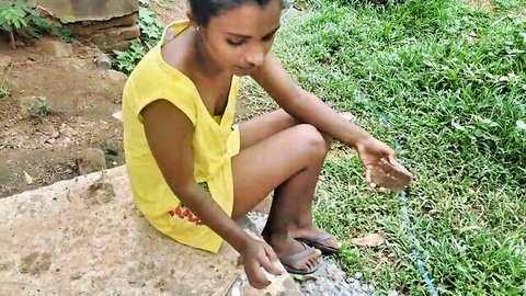 Indian college girl in yellow dress squats outdoors showing her curvy ass