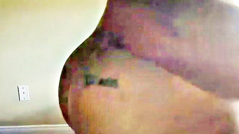 Tattooed ebony woman exposing her massive curvaceous booty