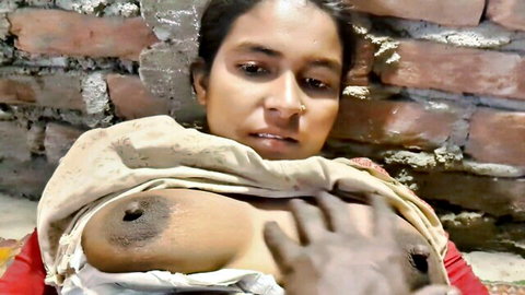 Desi Indian bhabhi exposing large dark nipple with hand groping in homemade video