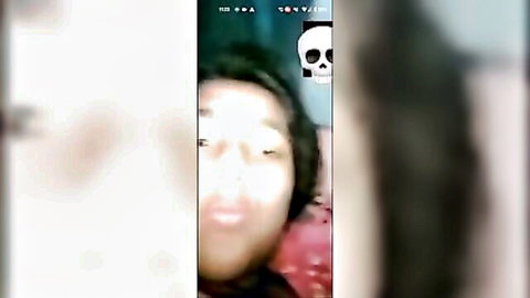 Blurry close-up of Bangladeshi girl making kiss face in amateur video