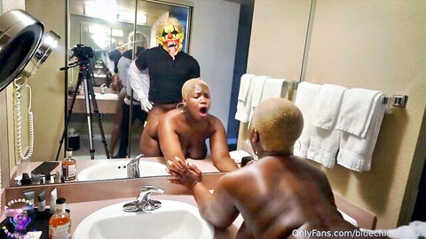 Thick ebony woman bent over getting clown dick from masked man