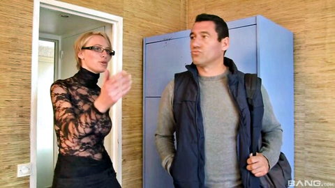 Blonde MILF in sheer lace top with glasses gestures at guy with big tits teasing