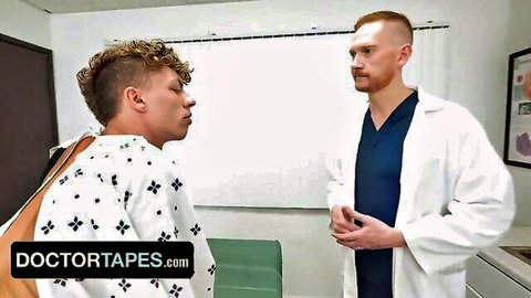 Ginger doctor in white coat faces young curly-haired patient with open hospital gown exposing bare back and ass in exam room
