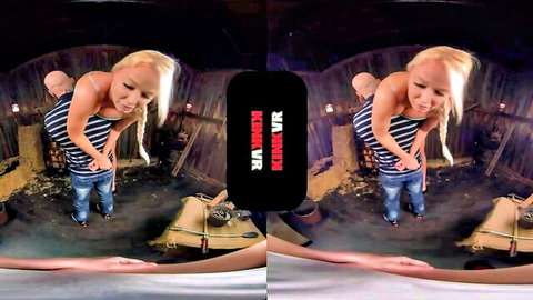Blonde babe bent over with jeans pulled down exposing bare ass in dark barn BDSM scene