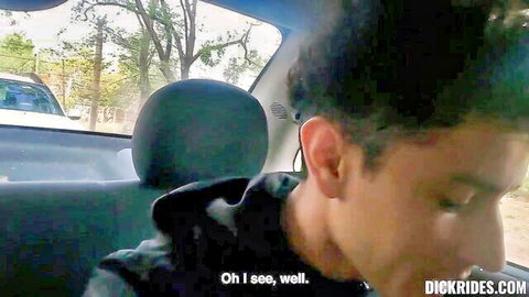 Curly-haired black guy in car smiling at POV camera before dick ride action