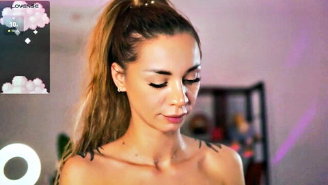 Topless brunette with ponytail and neck tattoos stares seductively in live webcam show