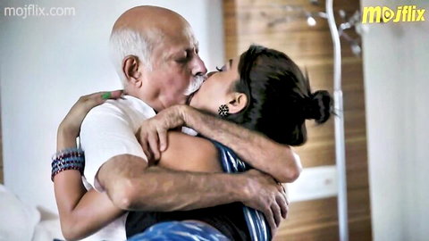 Indian teen in blue saree passionately kissed by old bald man in white shirt