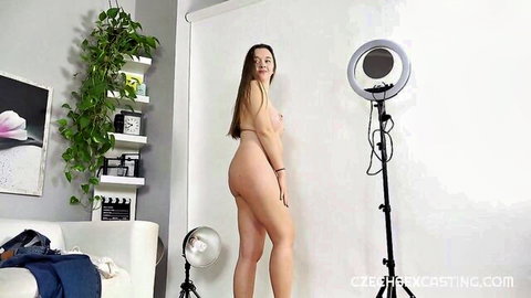 Nude babe with bubble butt posing sideways naked in Czech casting studio