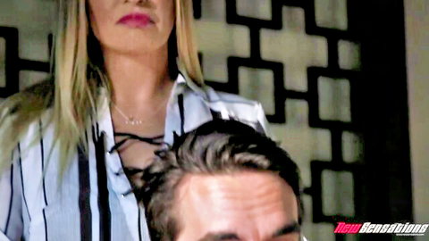 Claudia Valentine teases Logan Pierce with open blouse in family XXX scene