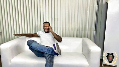 Brooke Haze couch scene with smiling muscular black man on phone