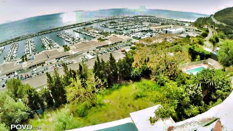 Nancy Ace scenic outdoor view of marina and pool before masturbation scene