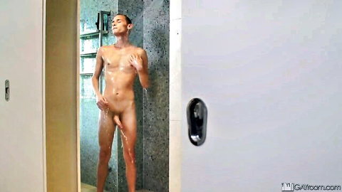 Naked Asian hunk showers nude with thick cock hanging visibly wet body