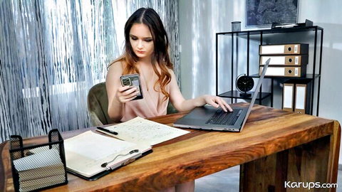 Vivien Doll in pink slip teasing at office desk, slim redhead model