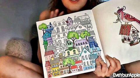 Petite college girl smiling while coloring book nude