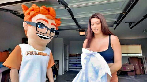 Busty brunette with big tits smiles at Pornhub mascot holding towel in garage