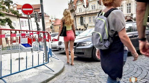 Skinny blonde teen walks in tight pink shorts revealing small ass cheeks on Prague street
