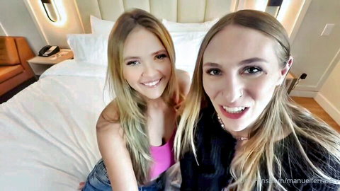 Angie Faith and Angel Youngs, busty blondes smiling in seductive selfie