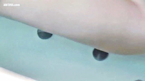 Cute Asian girl in water exposing small nipples closeup