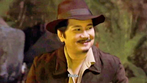 Smiling Asian man in fedora hat and jacket in Wow Mani Episode 3 (2025)
