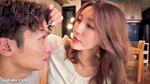 Sexy Japanese brunette wife intimately applies makeup to husband's face in kitchen homemade