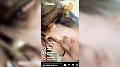 Sexy Asian woman with long hair and cleavage in tight top posing for camera closeup