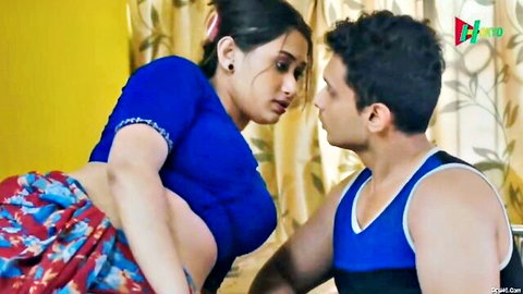 Busty Indian babe in tight blue saree blouse with huge natural tits leans for intimate kiss with muscular stud