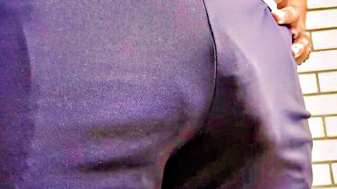 Hand grabbing huge cock bulge and ass in tight shiny purple pants against brick wall