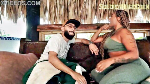 Curvy black MILF with braids in green outfit chats intimately with bearded guy