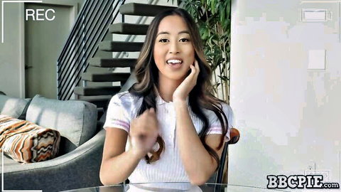 Alexia Anders Asian beauty smiles excitedly in white top for BBC Pie